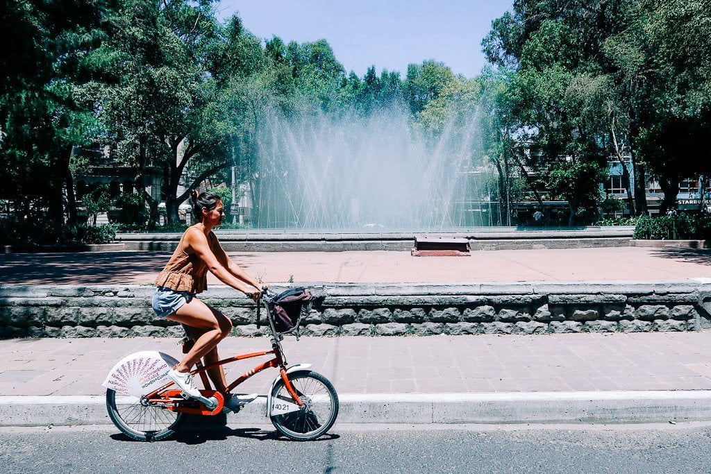kim biking in la roma on an ecobici in mexico city
